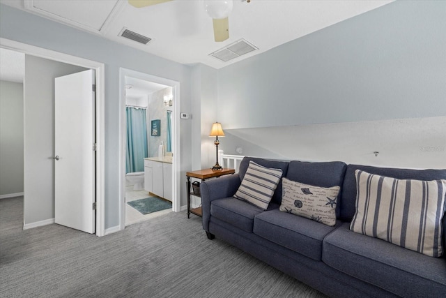 living room with ceiling fan and light carpet