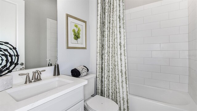 full bathroom featuring toilet, shower / bath combo, and vanity