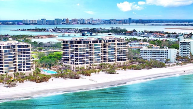 bird's eye view featuring a view of the beach and a water view