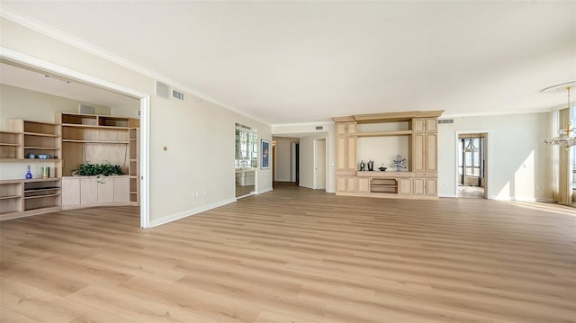 unfurnished living room with light hardwood / wood-style flooring and crown molding