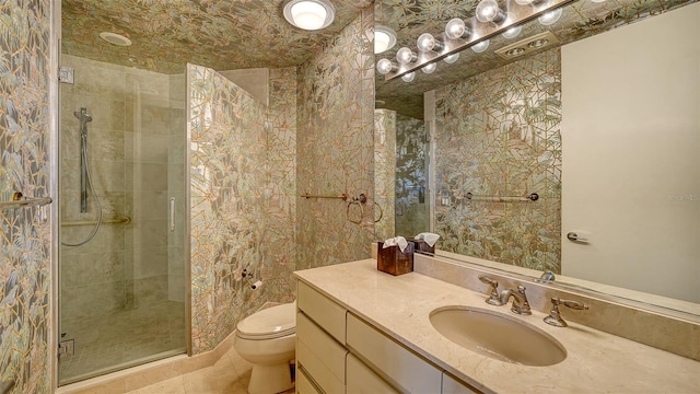 bathroom featuring toilet, vanity, an enclosed shower, and tile patterned flooring