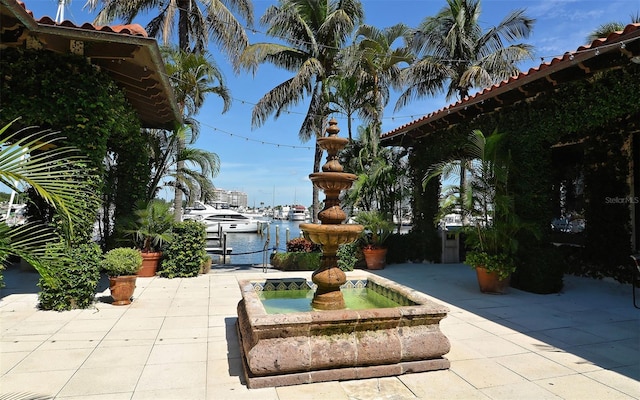 view of patio with a water view