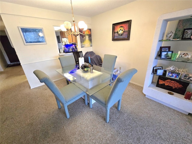 carpeted dining area with baseboards and a chandelier