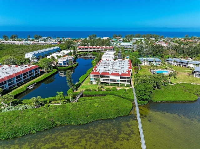 birds eye view of property featuring a water view