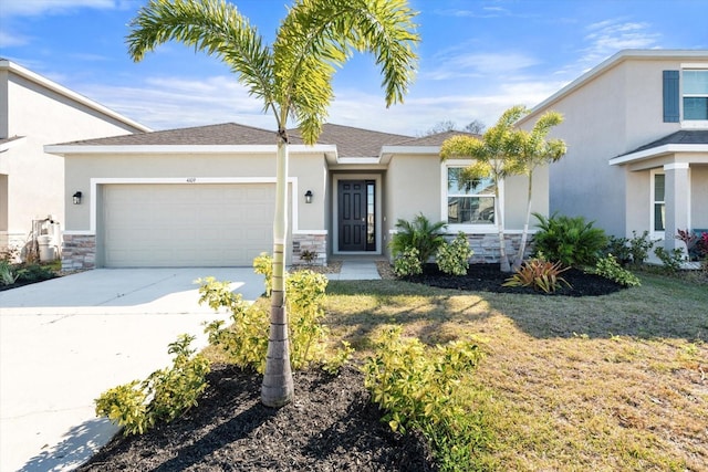 view of front of home featuring a garage and a front lawn