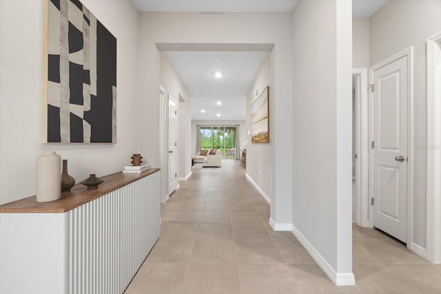 corridor featuring light tile patterned floors