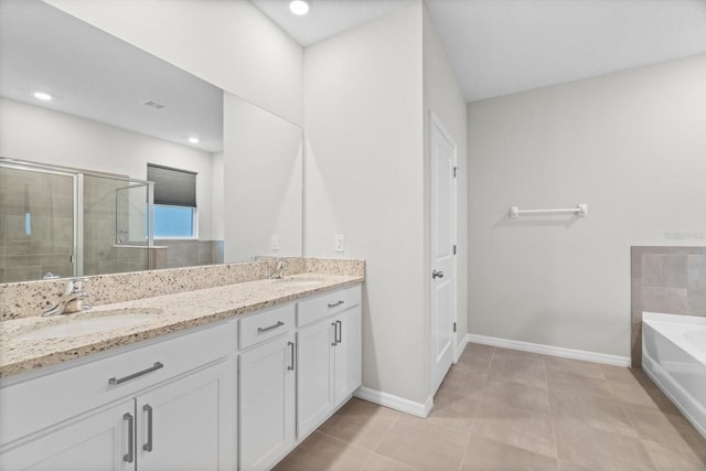 bathroom featuring vanity, independent shower and bath, and tile patterned flooring