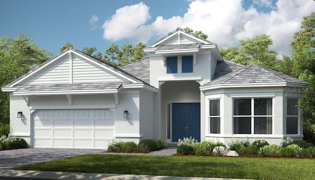 view of property featuring a front yard and a garage