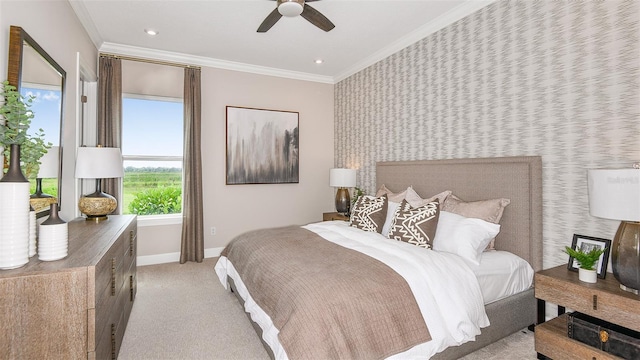 carpeted bedroom with ceiling fan and crown molding