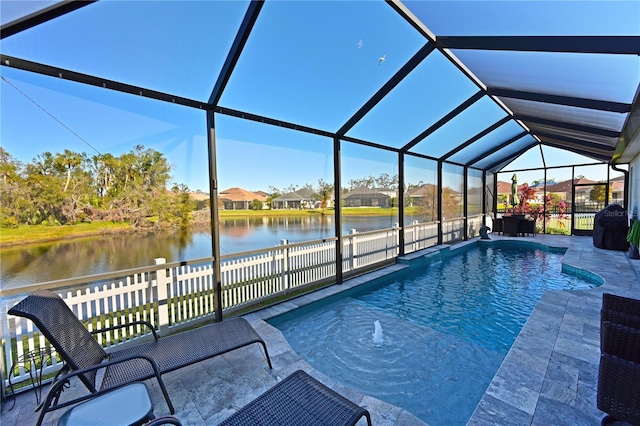 view of pool featuring a lanai, a water view, and a patio