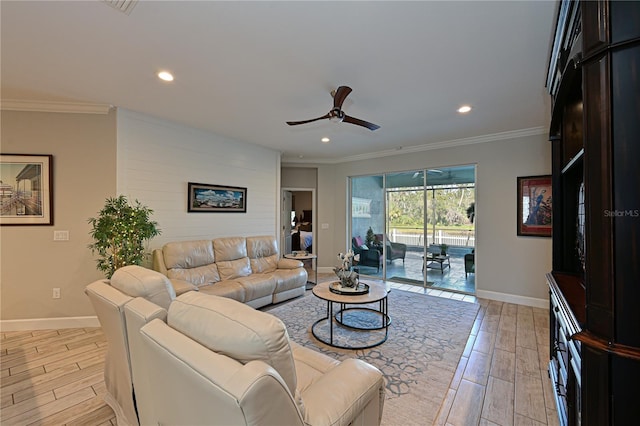 living room with ceiling fan and crown molding