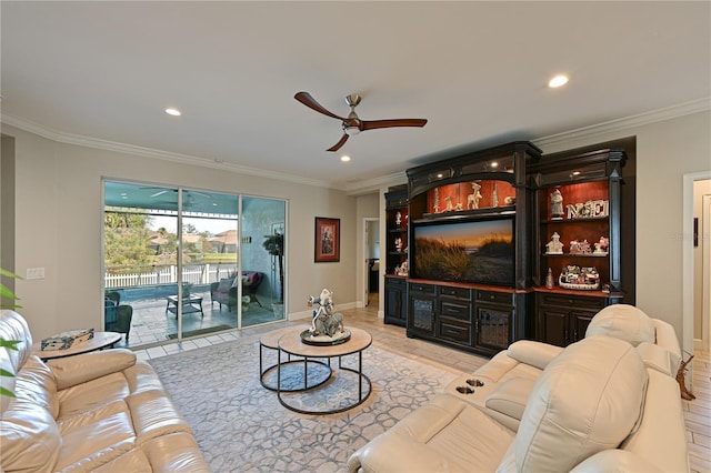 living room with ceiling fan and ornamental molding