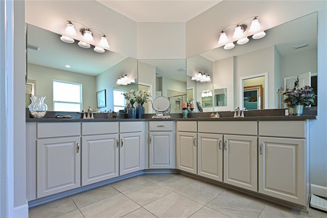 bathroom with tile patterned floors and vanity