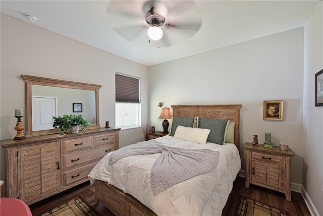 bedroom with ceiling fan and dark hardwood / wood-style floors