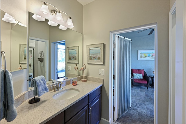 bathroom with walk in shower and vanity