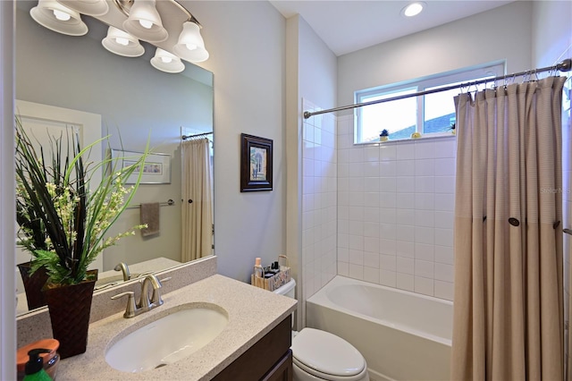 full bathroom with toilet, vanity, and shower / bath combo with shower curtain