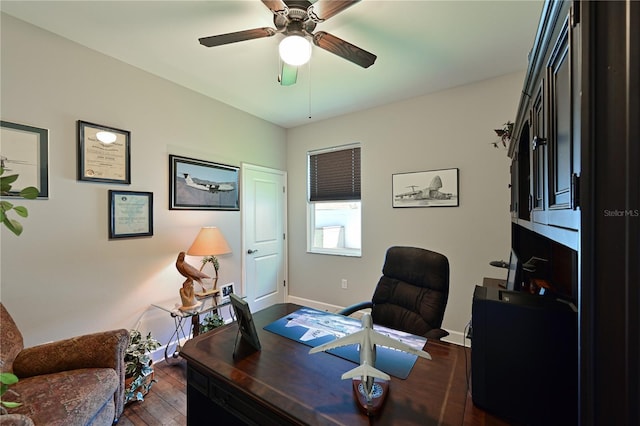 home office featuring ceiling fan and dark hardwood / wood-style floors