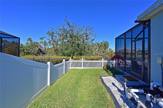 view of yard featuring glass enclosure