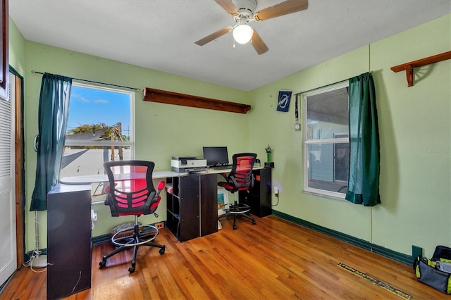 office area featuring hardwood / wood-style flooring and ceiling fan