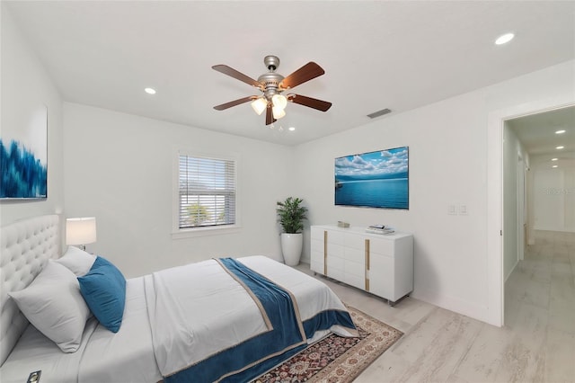 bedroom featuring ceiling fan and light hardwood / wood-style flooring