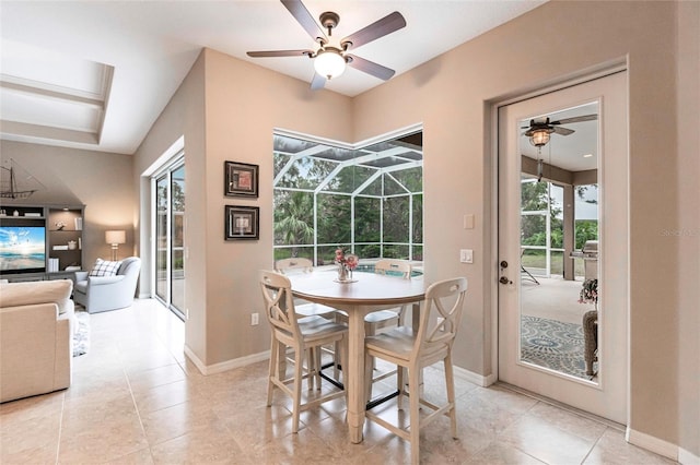 tiled dining space with ceiling fan