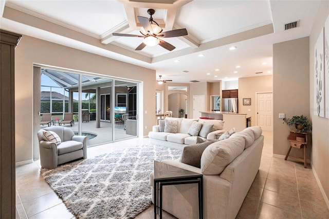 living room featuring light tile patterned flooring, coffered ceiling, ceiling fan, and beamed ceiling