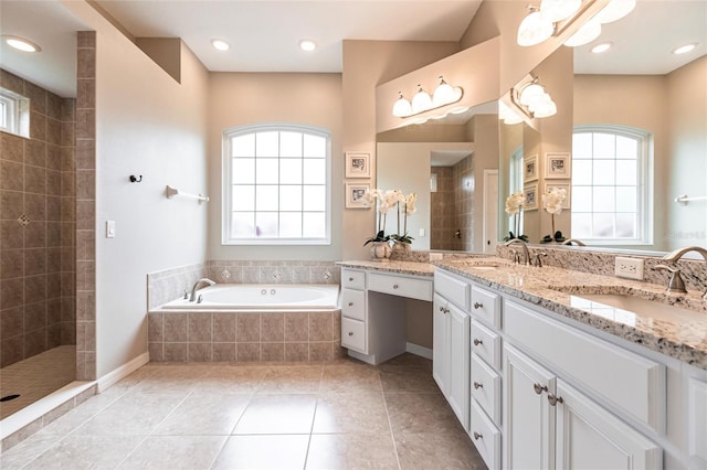 bathroom featuring vanity, shower with separate bathtub, tile patterned floors, and a healthy amount of sunlight