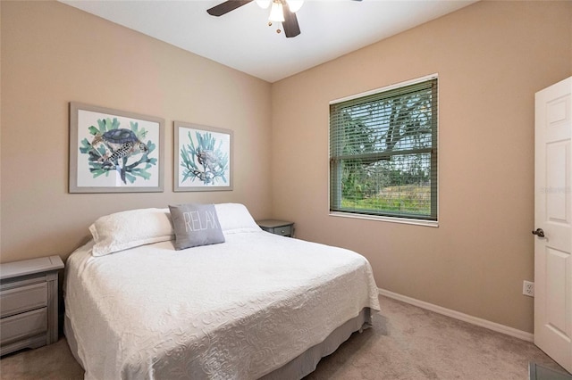 bedroom with light colored carpet and ceiling fan