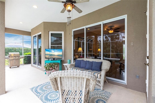 view of patio with outdoor lounge area, area for grilling, and ceiling fan