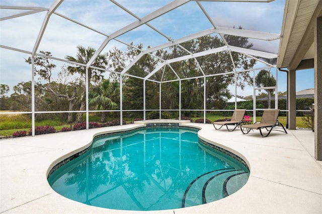 view of pool with a patio and a lanai