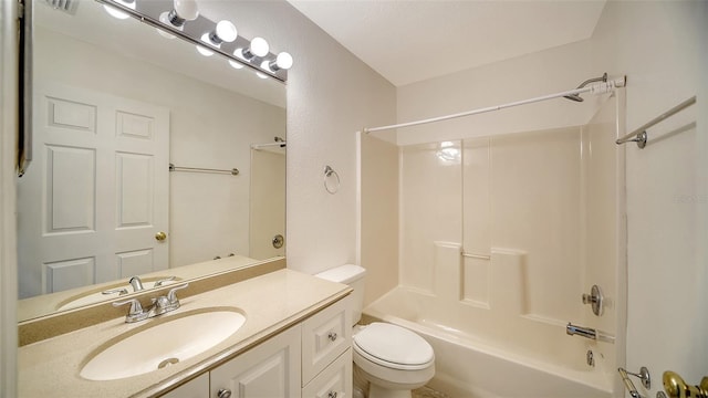 full bathroom featuring toilet, vanity, and  shower combination