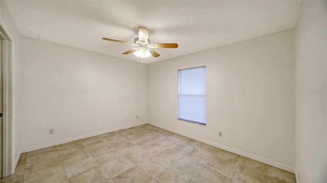 spare room featuring ceiling fan