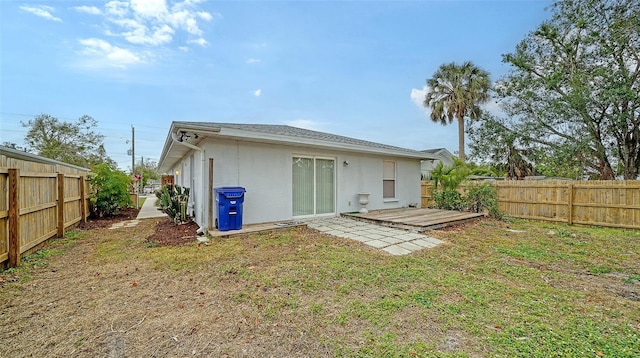 rear view of house with a lawn