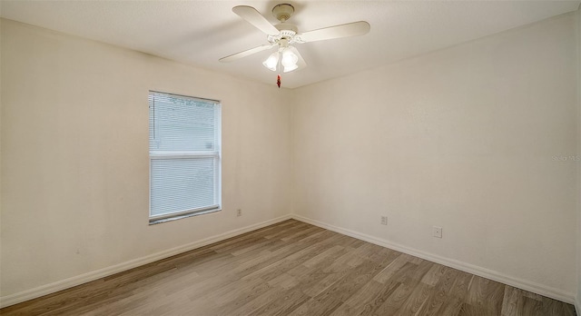 unfurnished room featuring hardwood / wood-style flooring and ceiling fan