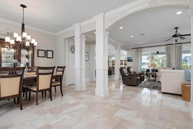 dining room with visible vents, ornate columns, arched walkways, ornamental molding, and ceiling fan with notable chandelier