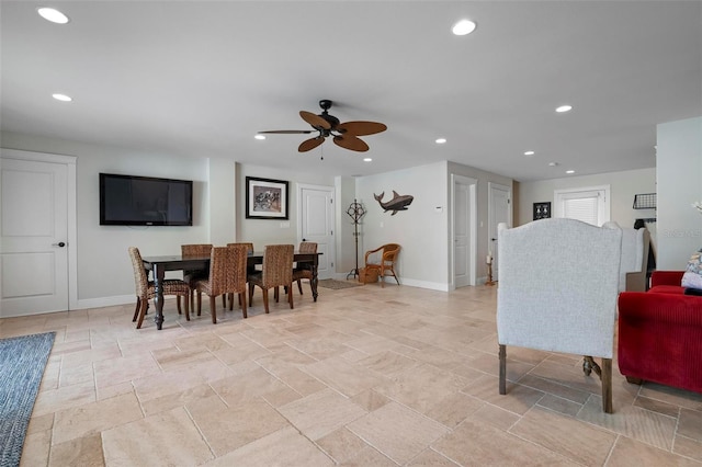 dining room featuring recessed lighting, baseboards, and stone finish flooring