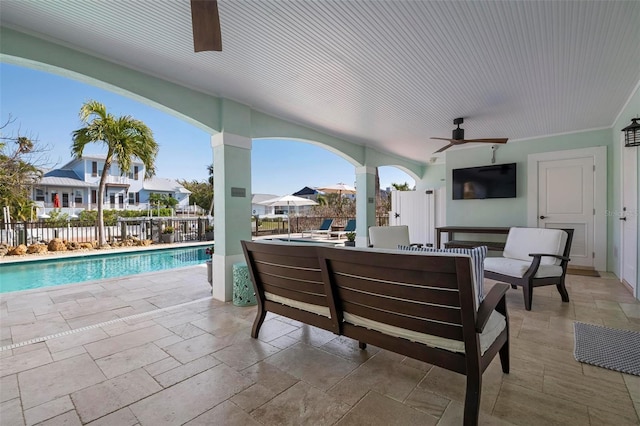 view of patio with outdoor dining area, a fenced backyard, a fenced in pool, and ceiling fan