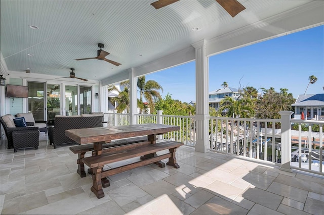 view of patio / terrace with outdoor dining area and a ceiling fan