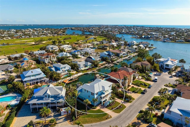 birds eye view of property with a residential view and a water view