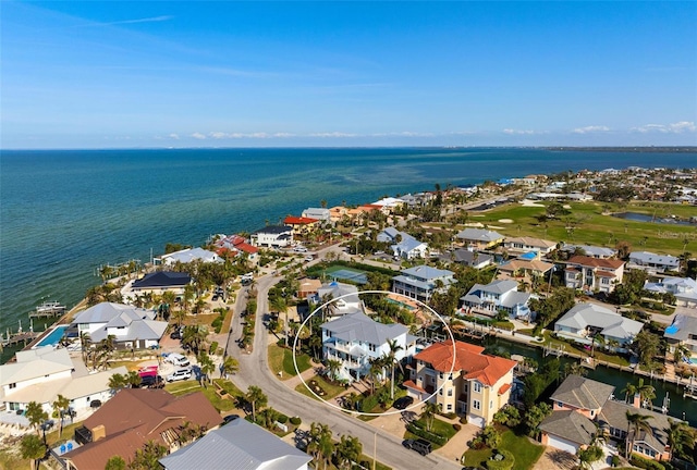 aerial view with a residential view and a water view