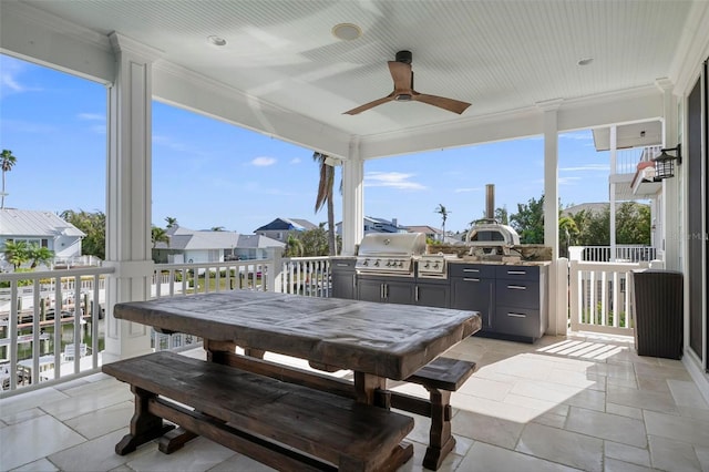 view of patio / terrace with an outdoor kitchen, a grill, outdoor dining area, and ceiling fan