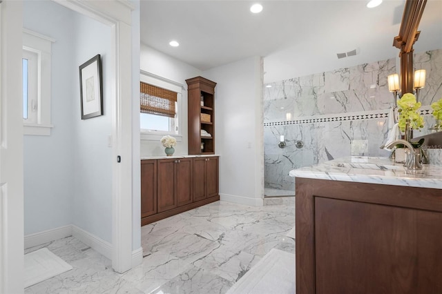 bathroom with vanity, visible vents, marble finish floor, and a marble finish shower