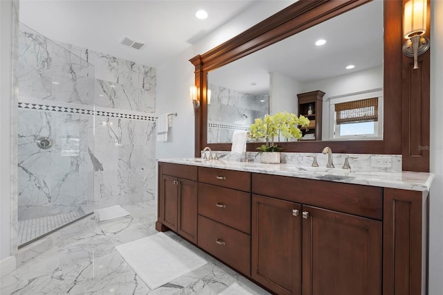 full bathroom with visible vents, marble finish floor, a sink, a marble finish shower, and double vanity