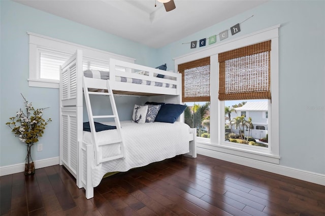 bedroom featuring ceiling fan, baseboards, and hardwood / wood-style floors