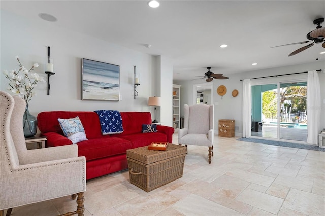 living area with a ceiling fan, recessed lighting, and baseboards