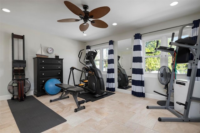 exercise room featuring recessed lighting, a healthy amount of sunlight, a ceiling fan, and baseboards