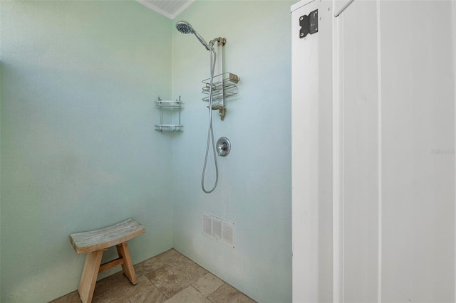 bathroom featuring a shower and visible vents