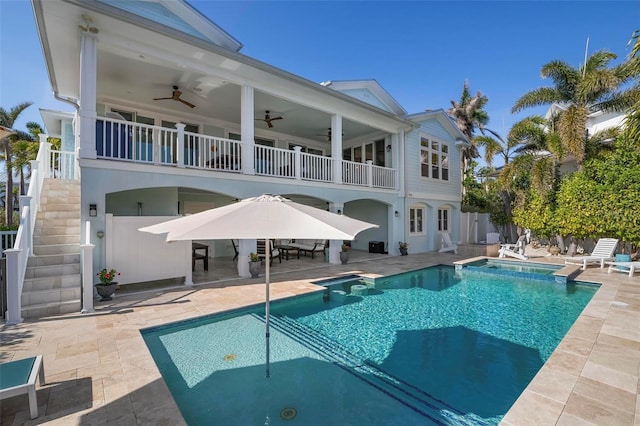 rear view of property with ceiling fan, stairs, a patio, and fence