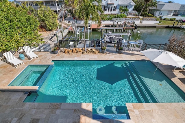 view of swimming pool with a fenced in pool, fence, a residential view, and a water view