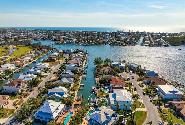 bird's eye view with a residential view and a water view